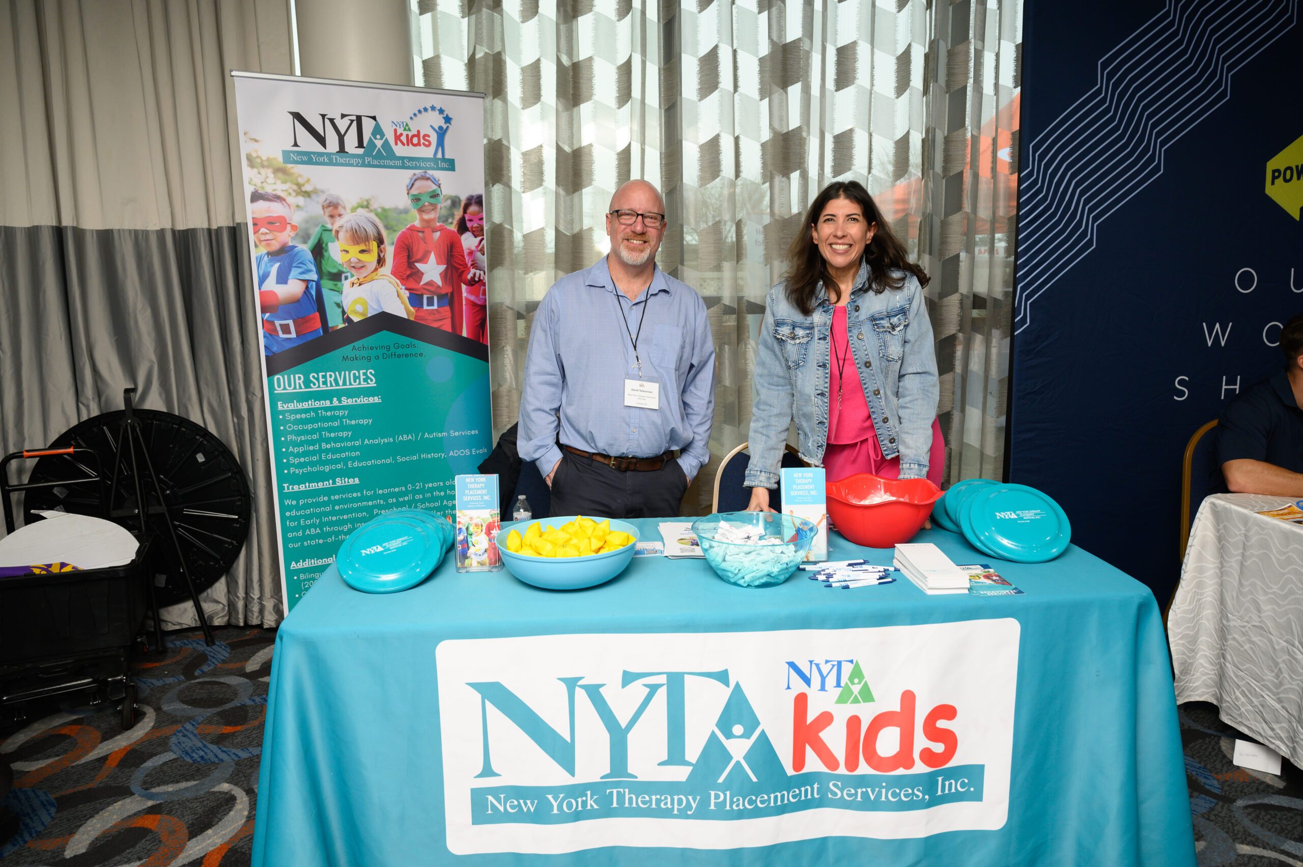 New York Therapy Placement Services representatives at their booth
