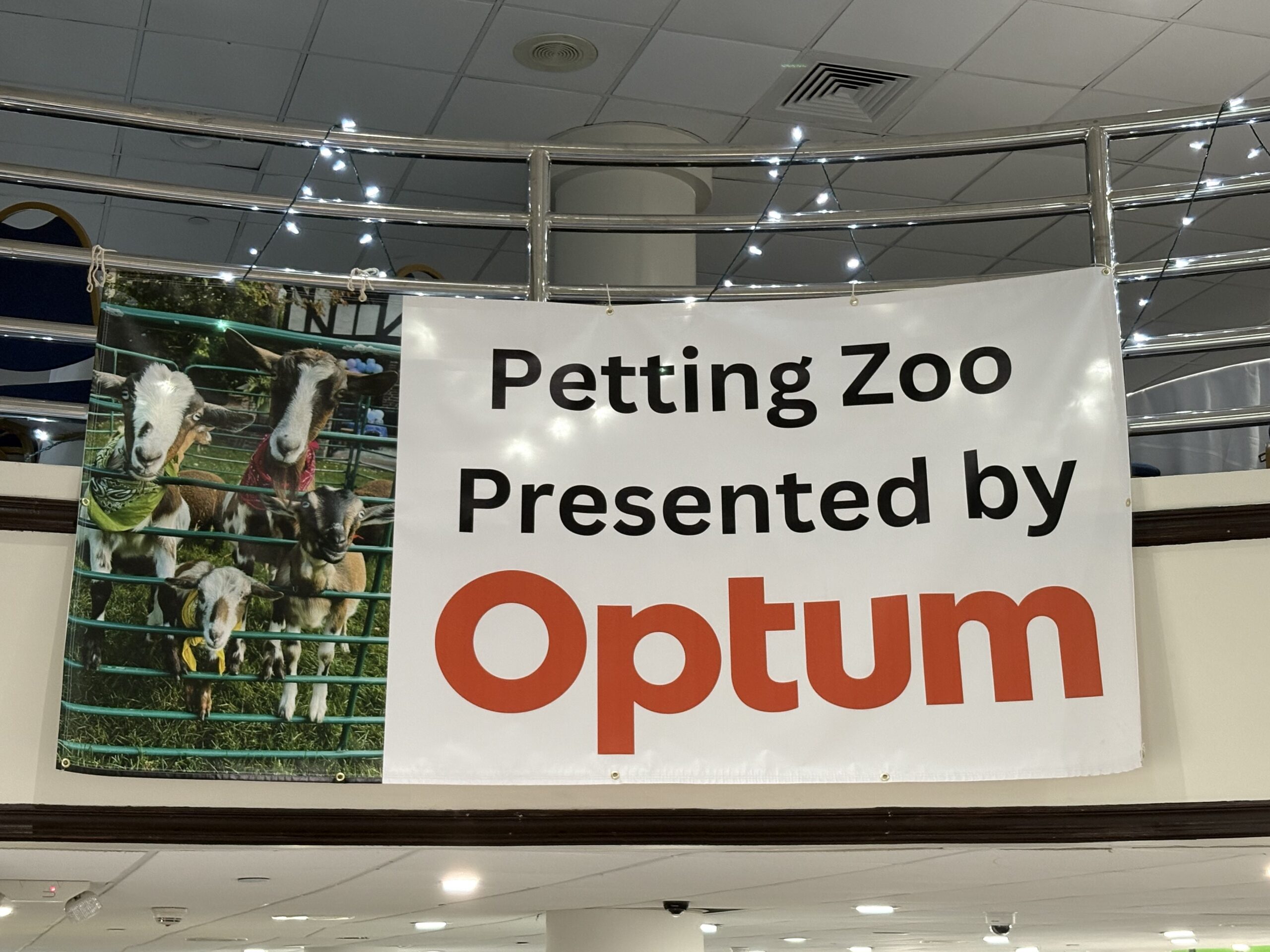Sign that reads Petting Zoo Presented by Optum